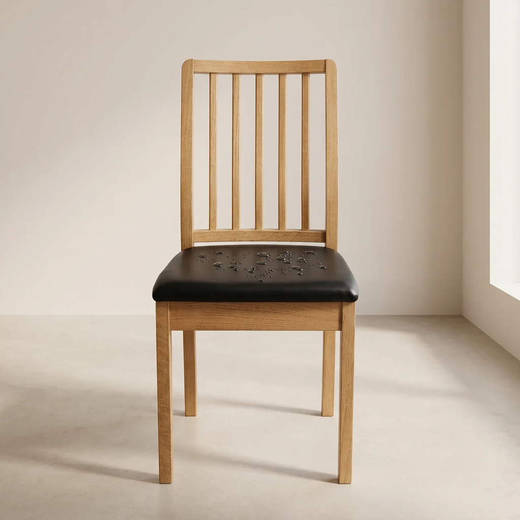 Wooden chair with a black leather seat in a minimalistic setting