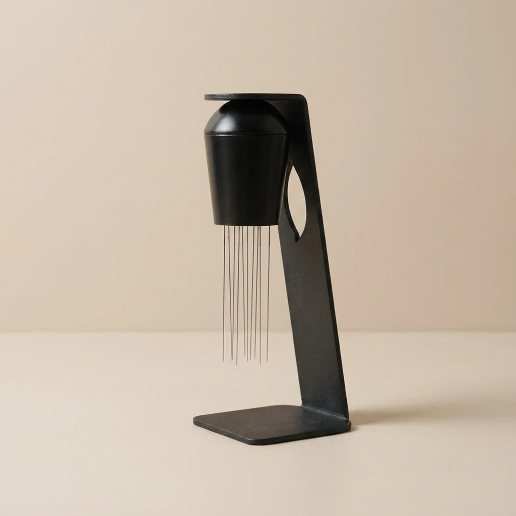 Black hairdresser's comb with water feature on a beige background