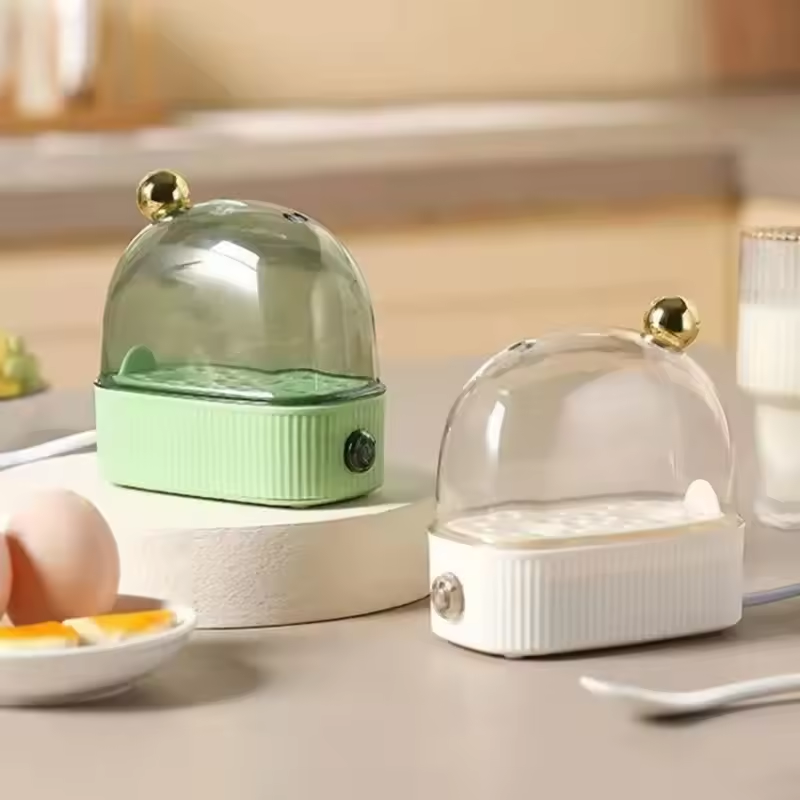 Two small kitchen appliances on a countertop with a blurred background