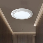 Round recessed ceiling light fixture on a modern ceiling