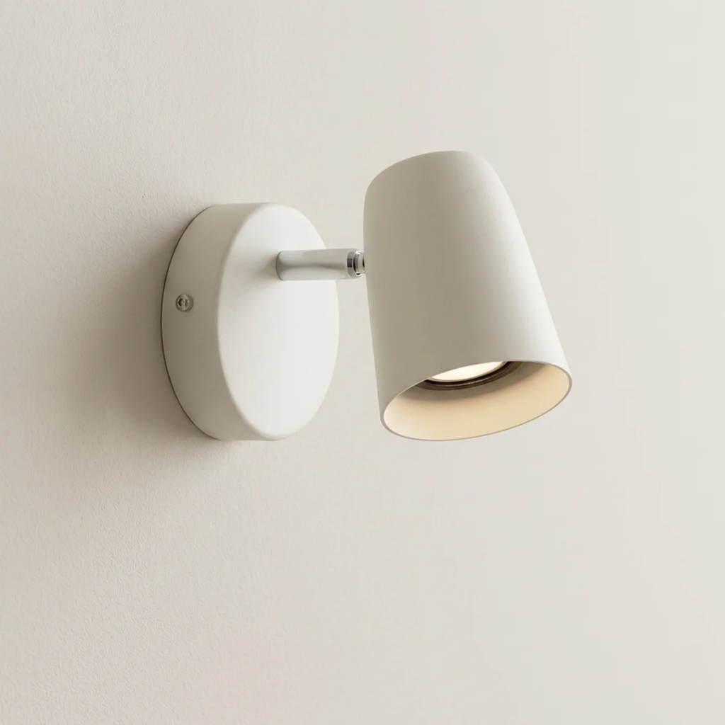 White wall-mounted lamp on a plain background