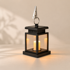 Black lantern with solar light on a beige background