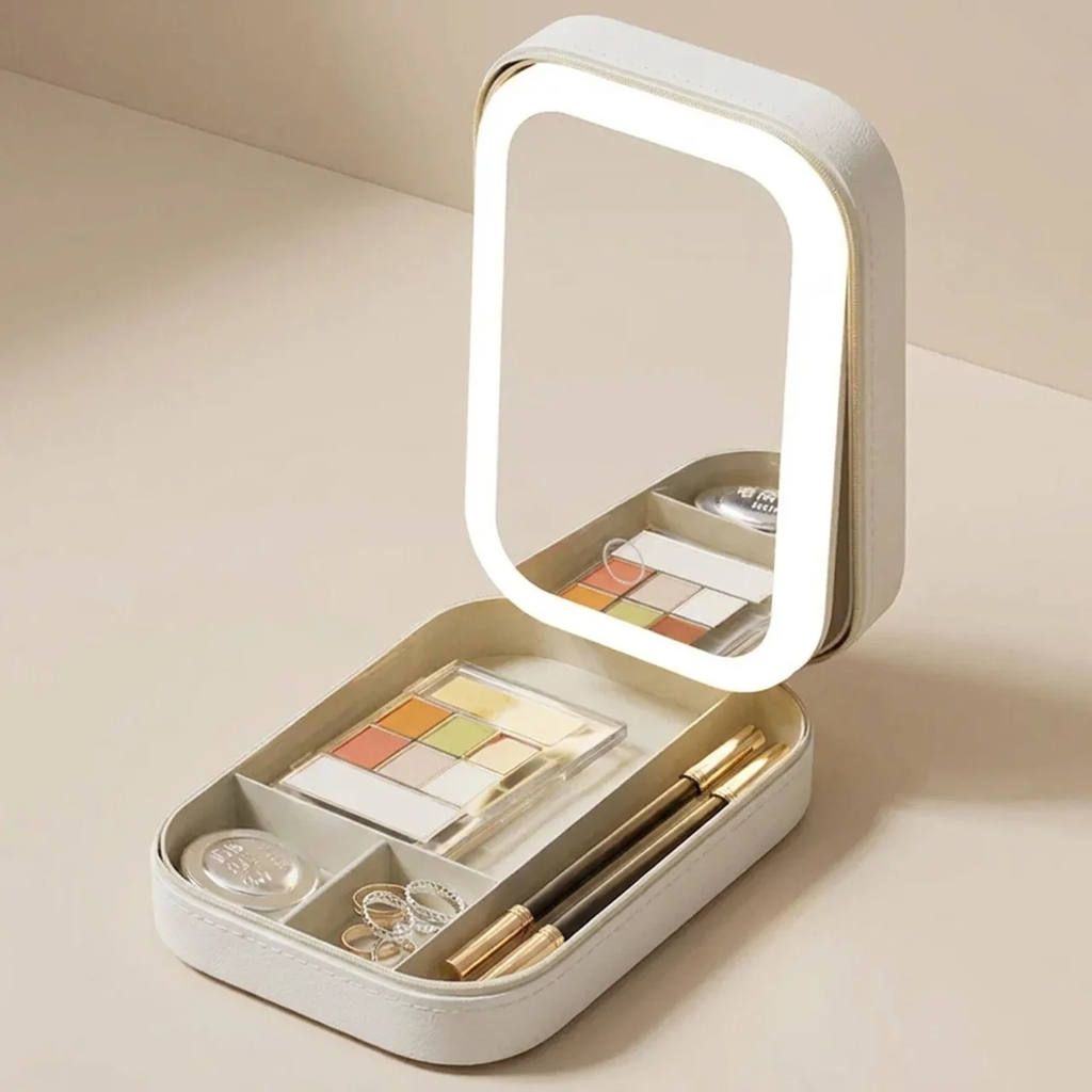 Makeup set with a light-up mirror on a beige background