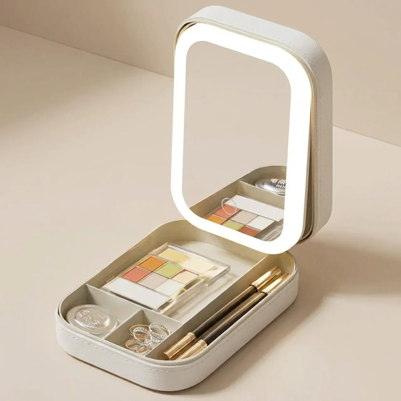 Makeup set with a light-up mirror on a beige background