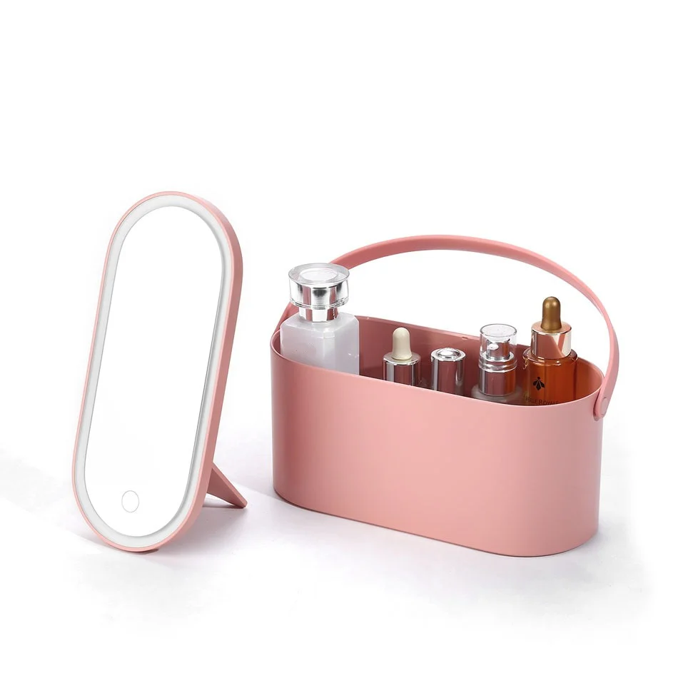 Pink cosmetic organizer with mirror and various bottles on a white background