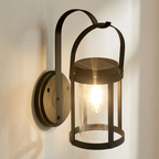 Wall-mounted lantern light fixture on a white wall