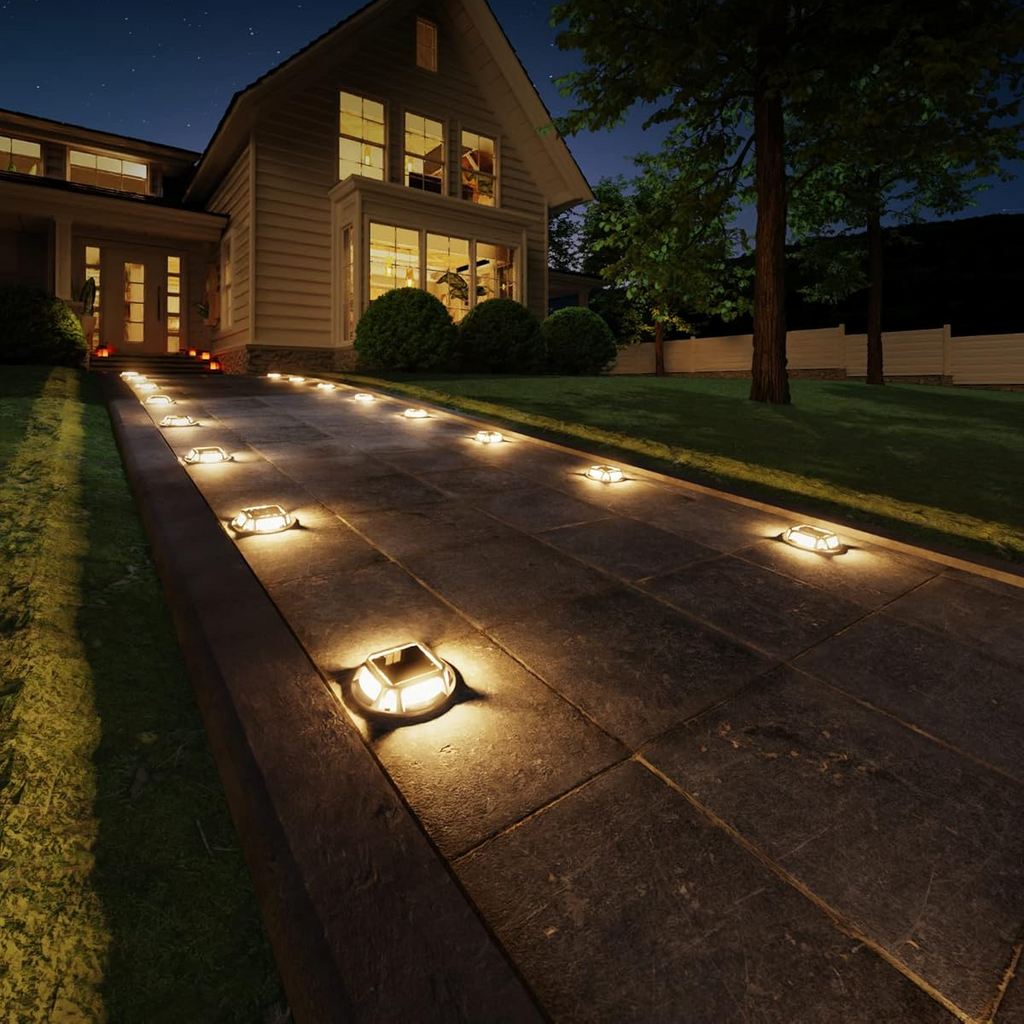 Sidewalk lights illuminating a pathway in front of a house with text about 3000K warm white lighting.