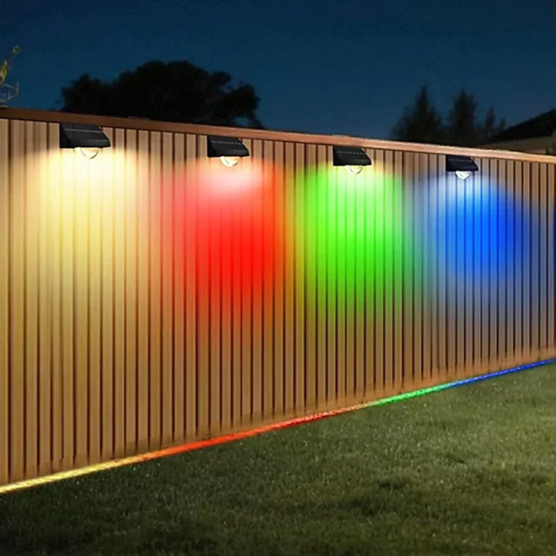 Solar-powered lights on a wooden fence with colorful light display