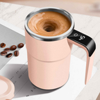 Pink coffee maker with a digital display on a white surface with coffee beans.