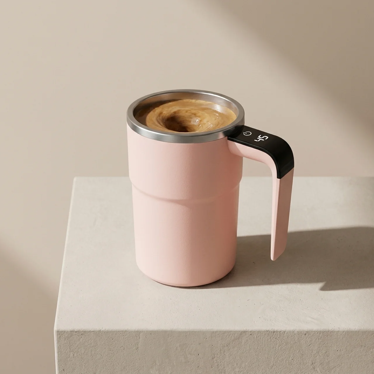 Pink travel mug with a handle filled with coffee on a beige background