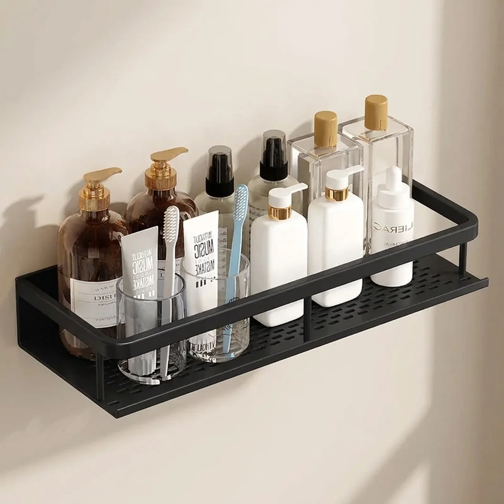 Black metal shelf with bathroom products on a beige wall