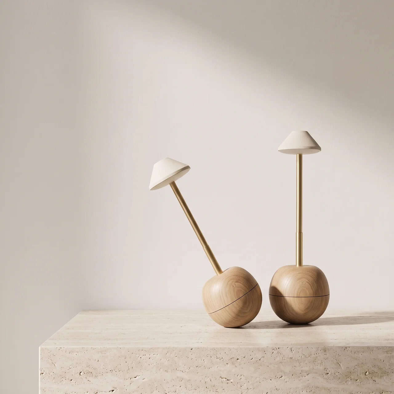 Two mushroom-shaped table lamps with light wood bases and white conical shades, displayed on a stone surface against a warm beige wall.