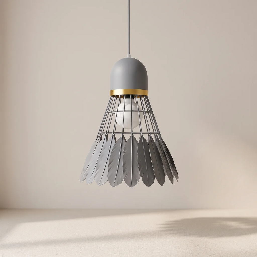 A modern pendant light shaped like a shuttlecock, featuring a matte gray top and bottom, a gold metallic band, and a wire cage holding a clear glass globe bulb, suspended against a minimalist beige background.