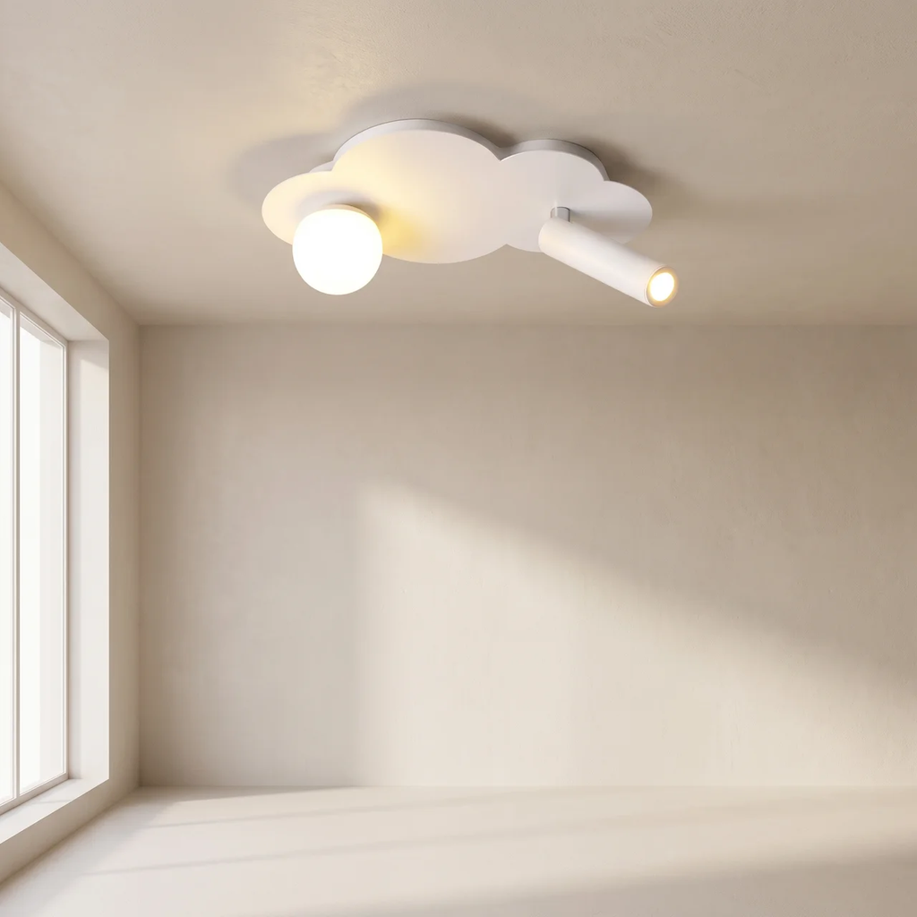 A modern cloud-shaped ceiling light fixture in white, featuring a frosted globe bulb and a directional spotlight, shown installed on a beige wall and ceiling in a minimalist room.