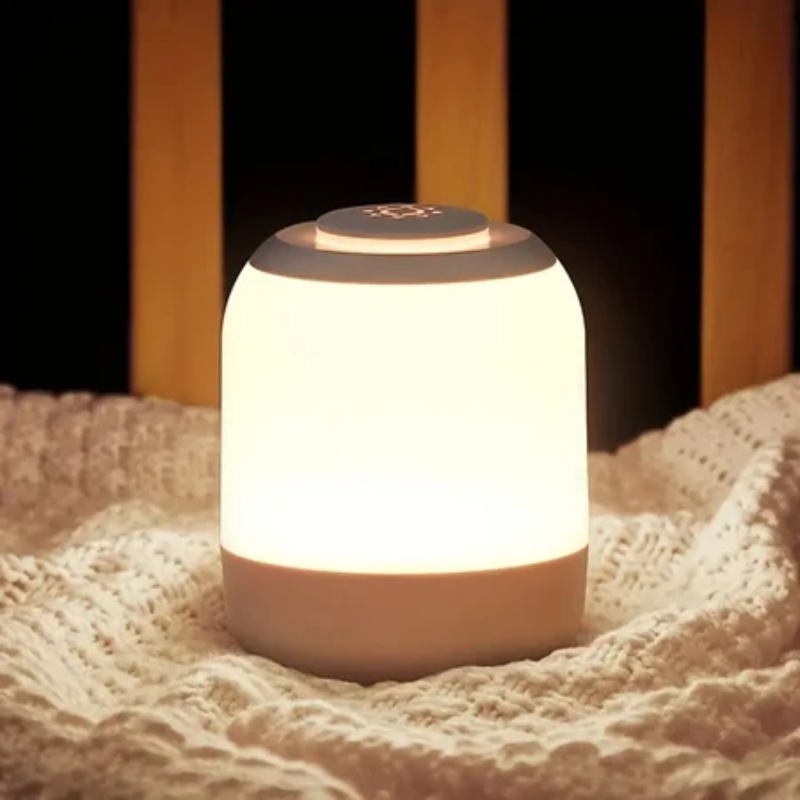 White night light on a textured surface with a blurred wooden background