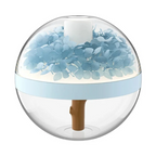 Clear spherical container with blue floral arrangement on a white background