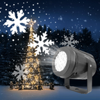 Outdoor Christmas scene with a tree and snowflake projector