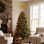 A decorated Christmas tree stands in a cozy living room beside a stone fireplace, with stockings, chairs, and wrapped gifts visible. The tree is green with warm white lights, red and gold ornaments, and a large gold star topper.