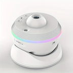 A white smart baby monitor camera with a matching white base dock, featuring a colorful LED light strip around the middle.