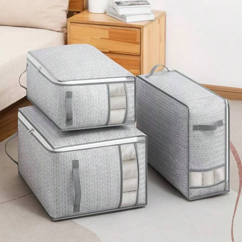 Set of gray storage bags with clear panels on a light-colored floor.