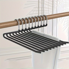 A set of black multi-hanger clothes hangers with silver metal hooks, shown hanging from a wooden rod on a light-colored wall.