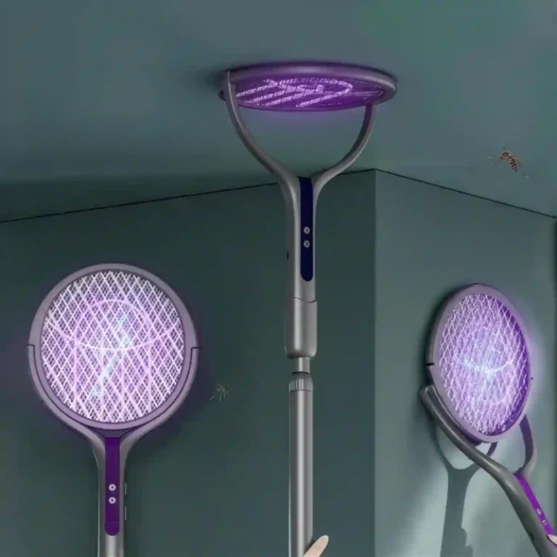 Three electric mosquito traps with purple glowing nets and silver handles shown in a room corner, with a hand holding one at the bottom.
