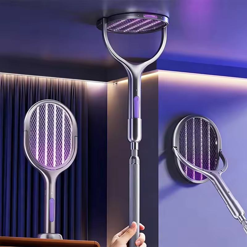 A silver electric mosquito killer bug trap with a purple UV light grid, shown in multiple views including a handheld stick version, a wall-mounted version, and a standing version. A hand is visible holding the stick version.