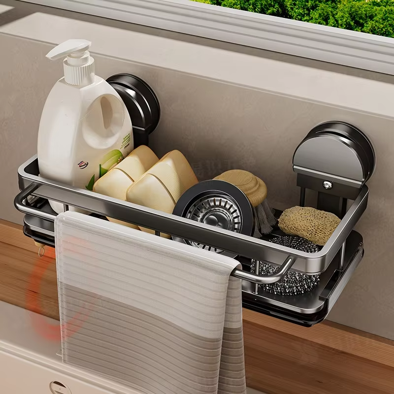 Kitchen sink caddy with various utensils and a bottle of soap on a wooden countertop.