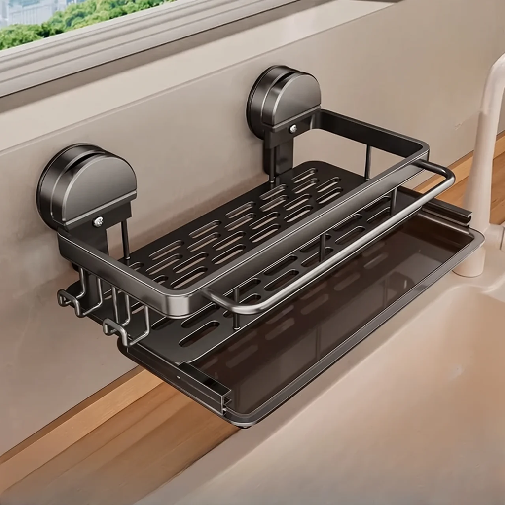 A dark gray metal wall-mounted bathroom shelf with two suction cup holders, shown attached to a beige wall above a sink.