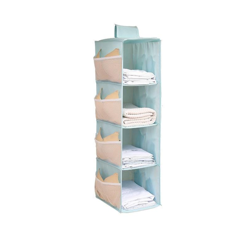 A light blue fabric hanging organizer with five tiers, shown filled with folded white towels and beige baby items, on a solid white background.