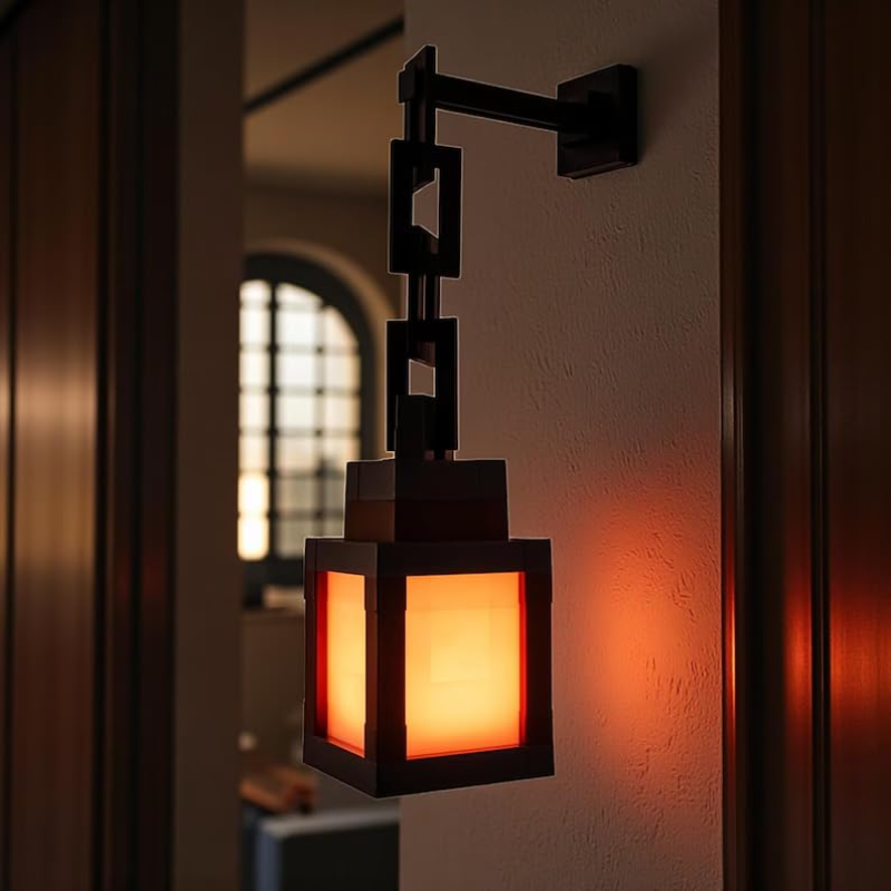 A modern black metal wall sconce with a glowing warm orange light, mounted on a textured beige wall in a dimly lit interior setting.