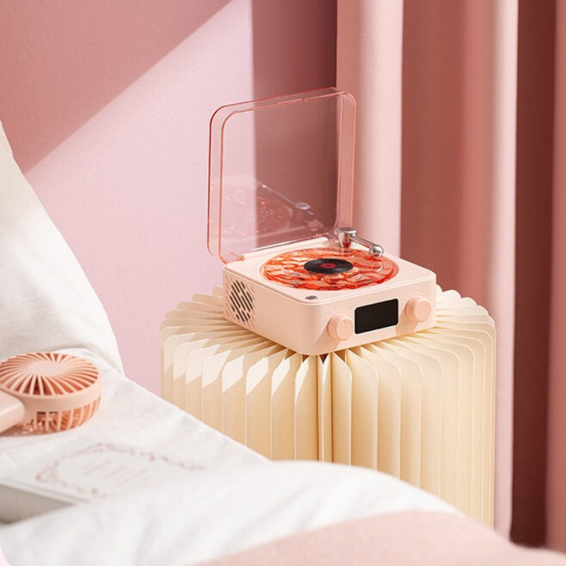 Pink electronic device on a stand with a blurred background