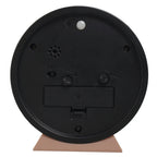 Black round object with a beige base on a white background