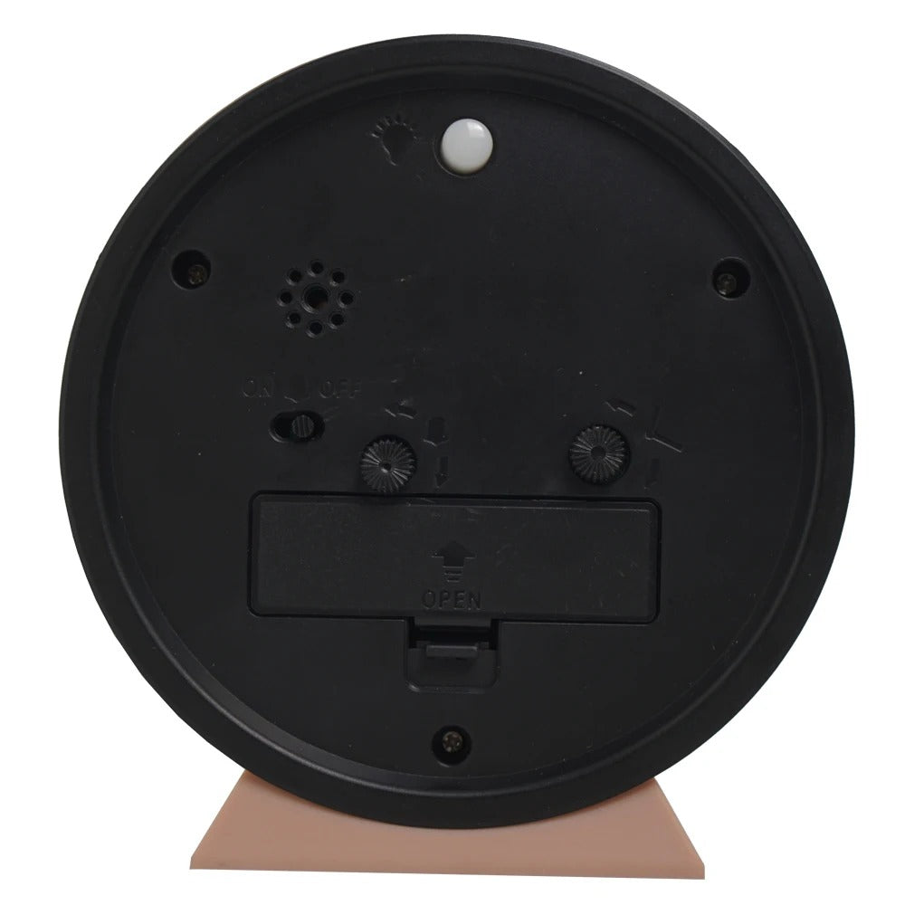 Black round object with a beige base on a white background