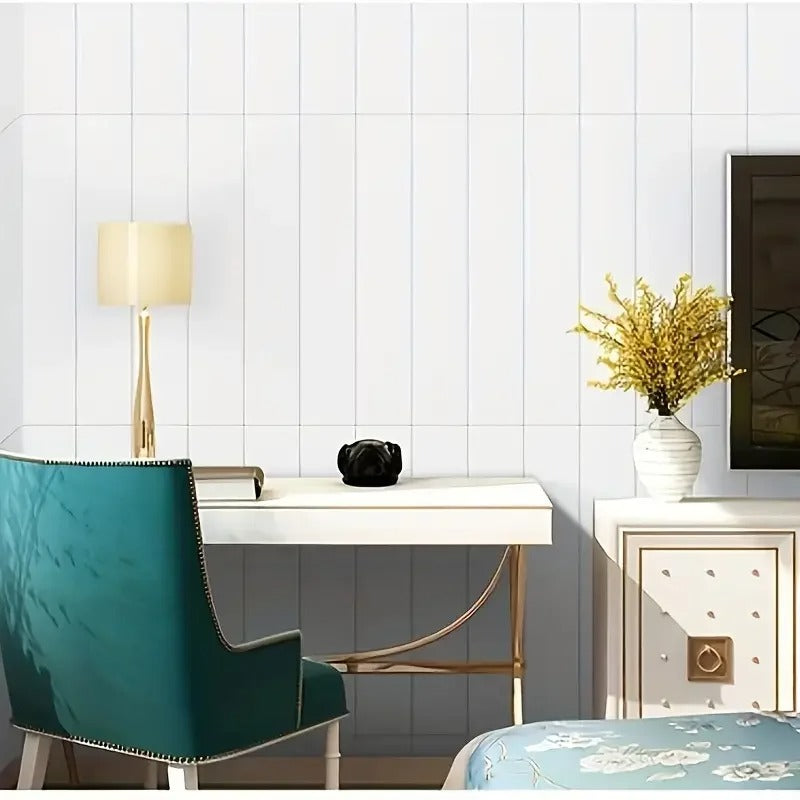 Modern interior with a desk, chair, and decorative elements against a white tiled wall.