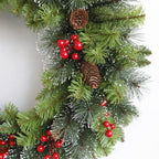 Christmas garland with green pine branches, red berries, and brown pine cones on a white background.