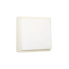 Square wall light fixture with a white shade on a white background