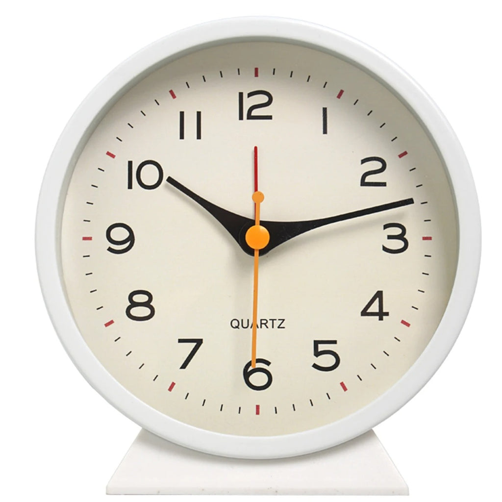 White clock with a beige face on a white background