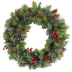 Christmas wreath with greenery, red berries, and pinecones on a white background