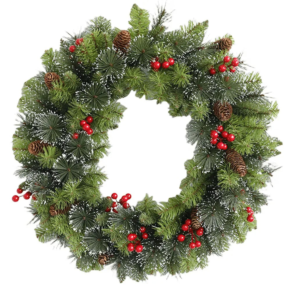 Christmas wreath with greenery, red berries, and pinecones on a white background