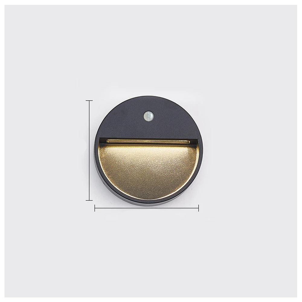 Round metallic light fixture with dimensions on a white background