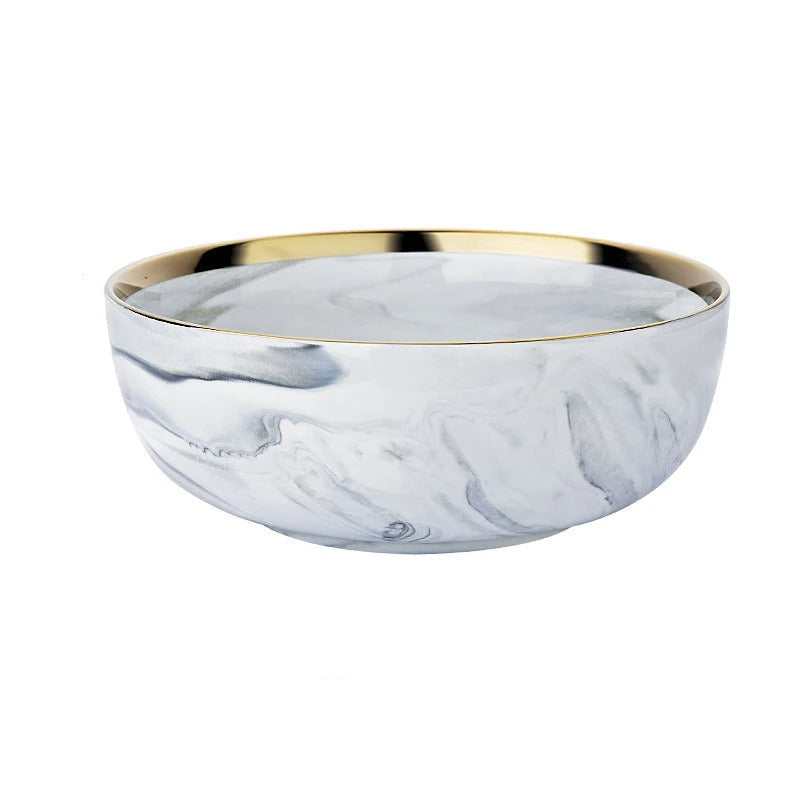 Marble-patterned soup bowl with gold rim and measurements on a white background