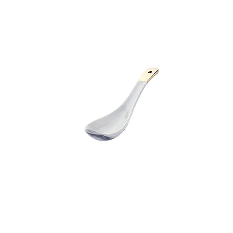 A white ceramic spoon with a gold-colored handle tip, shown with dimension lines indicating a length of 14cm, width of 4.3cm, and height of 4.